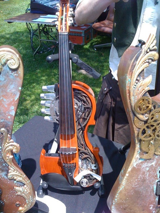 Illustration for article titled Modded Violin adds Steampunk-esque Styling, One Extra String